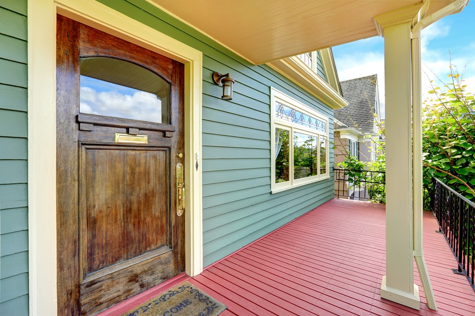 the front porch stuns with quality craftsmanship and colors.